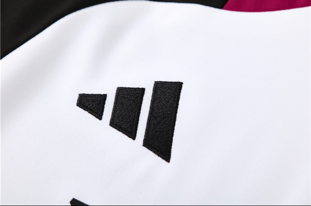 24/25 Manchester United White, Black And Red 1/4 Zip Tracksuit