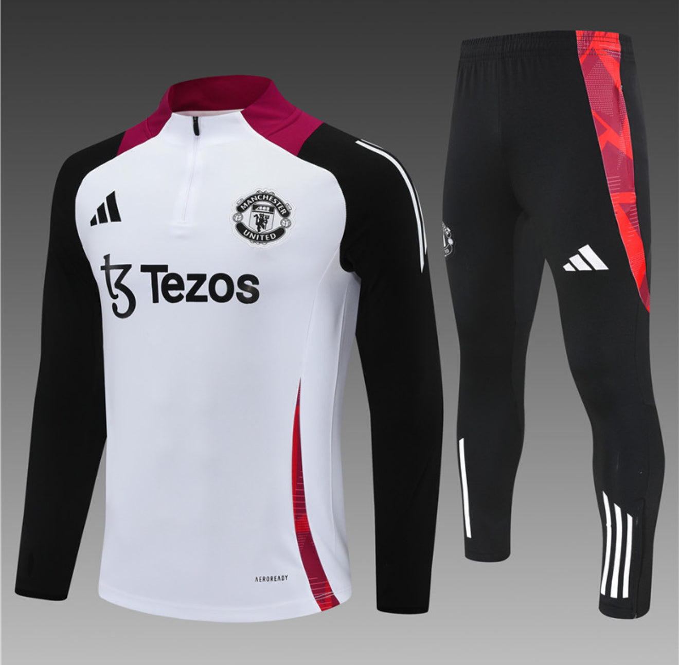 24/25 Manchester United White, Black And Red 1/4 Zip Tracksuit