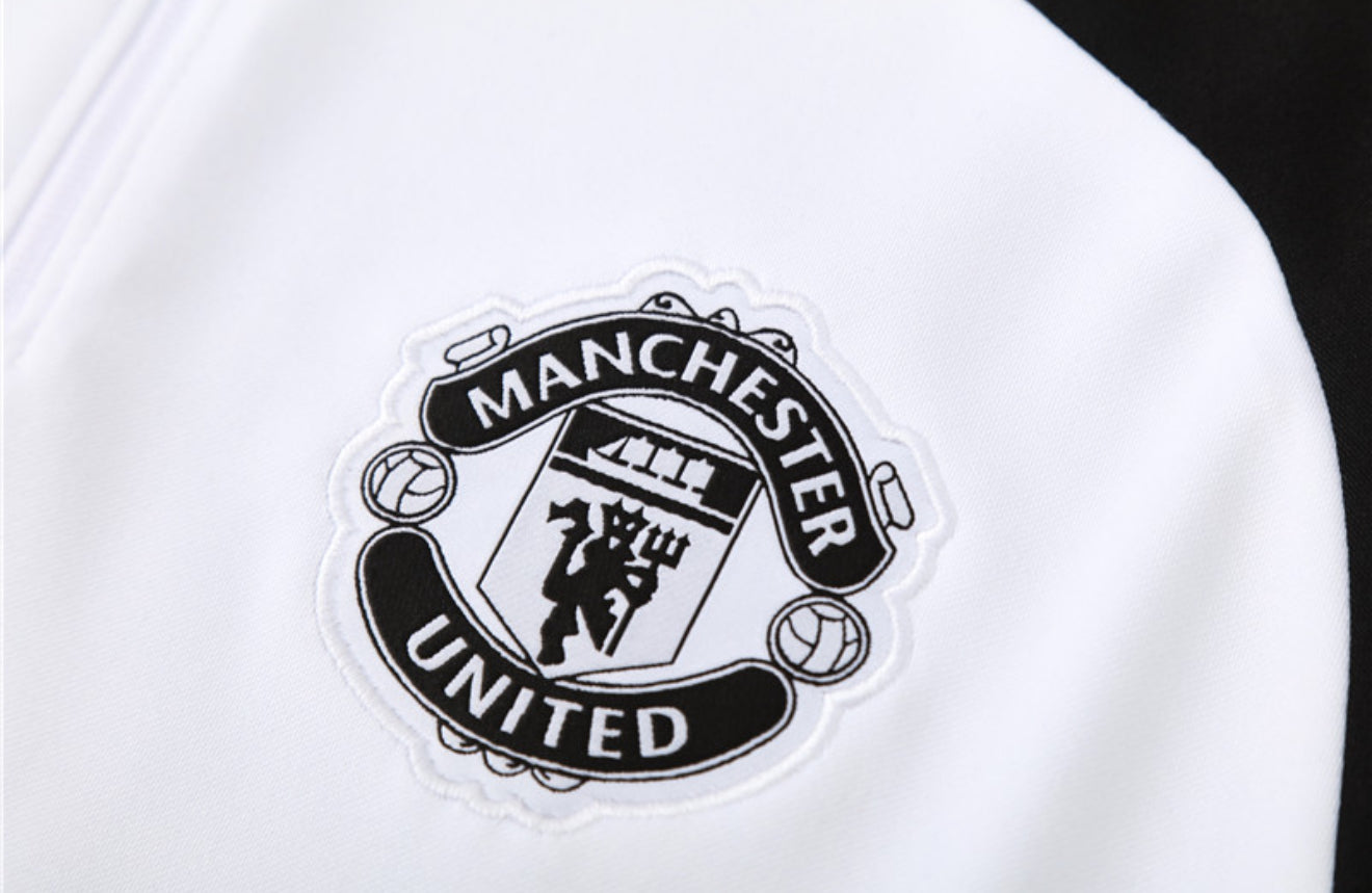 24/25 Manchester United White, Black And Red 1/4 Zip Tracksuit