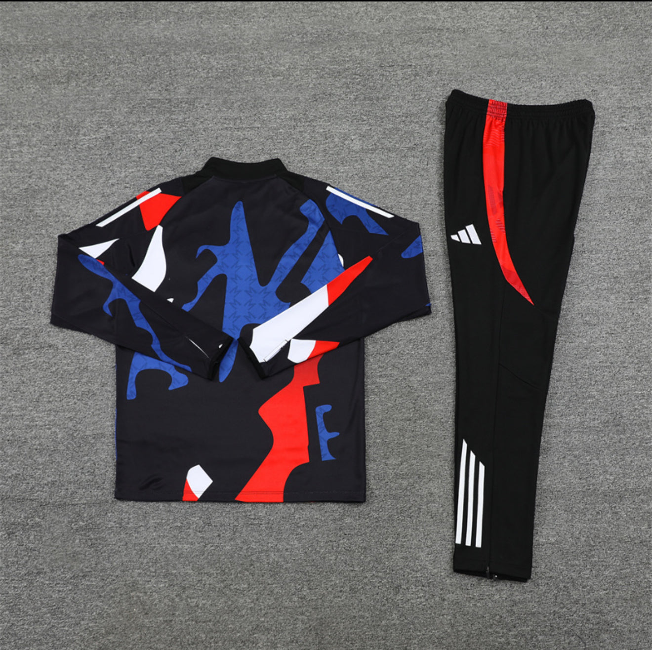 24/25 Manchester United Red, Black And Blue 1/4 Zip Tracksuit