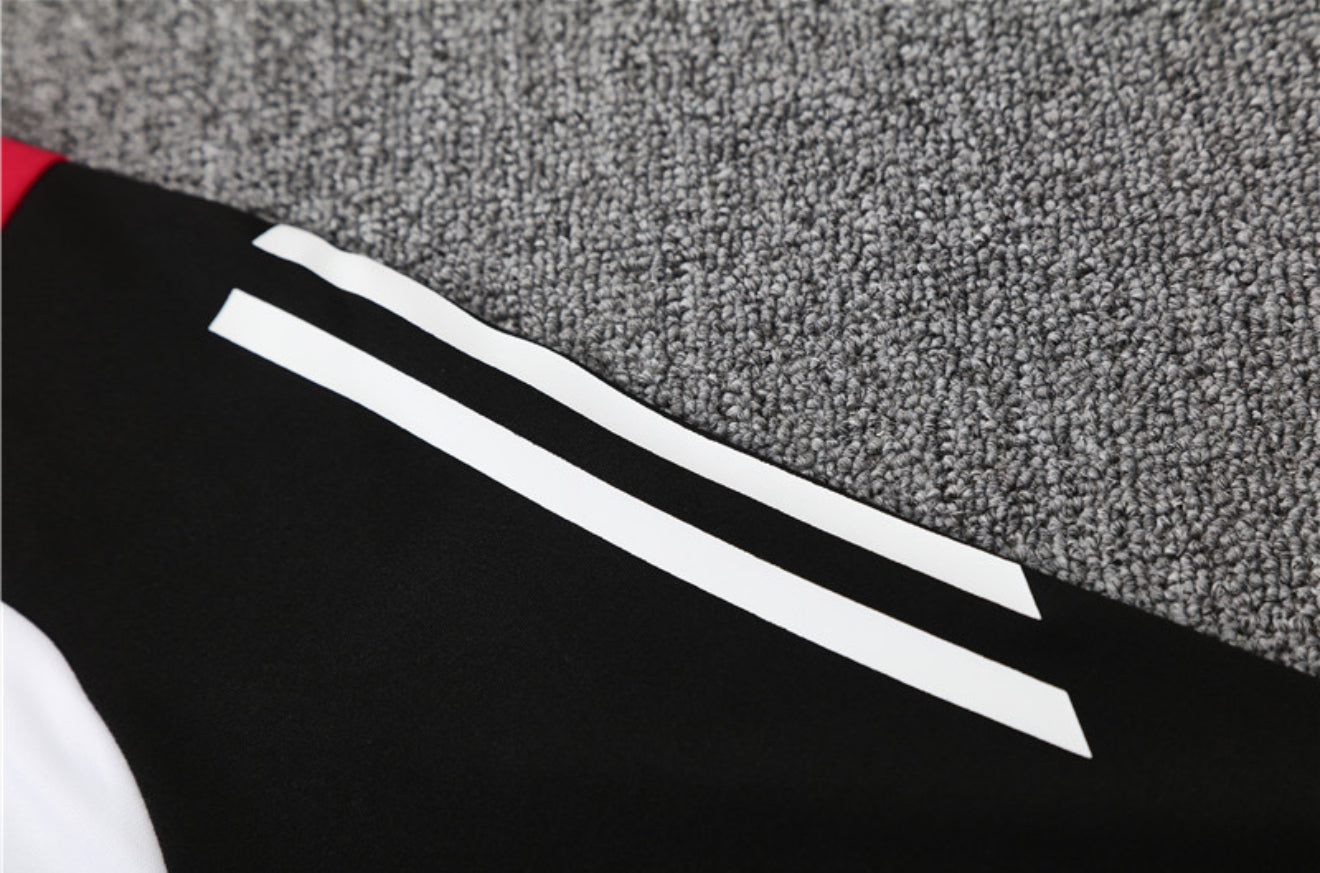 24/25 Manchester United White, Black And Red 1/4 Zip Tracksuit
