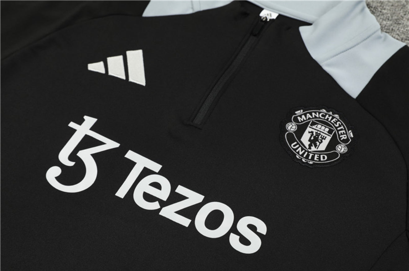24/25 Manchester United Black 1/4 Zip Tracksuit