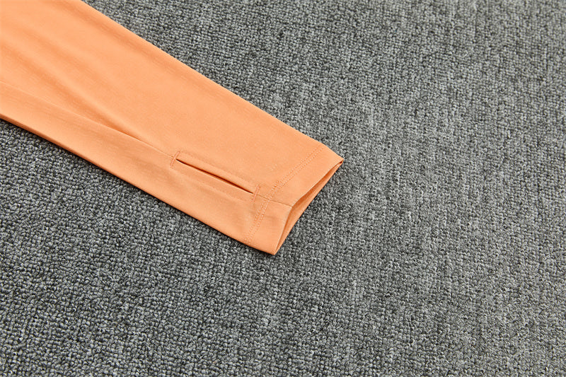 26/27 Arsenal Black And Orange 1/4 Zip Tracksuit