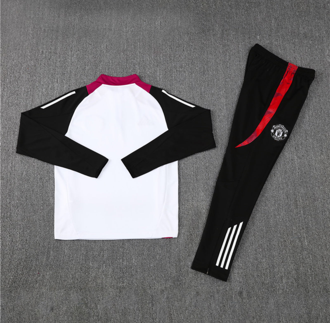 24/25 Manchester United White, Black And Red 1/4 Zip Tracksuit