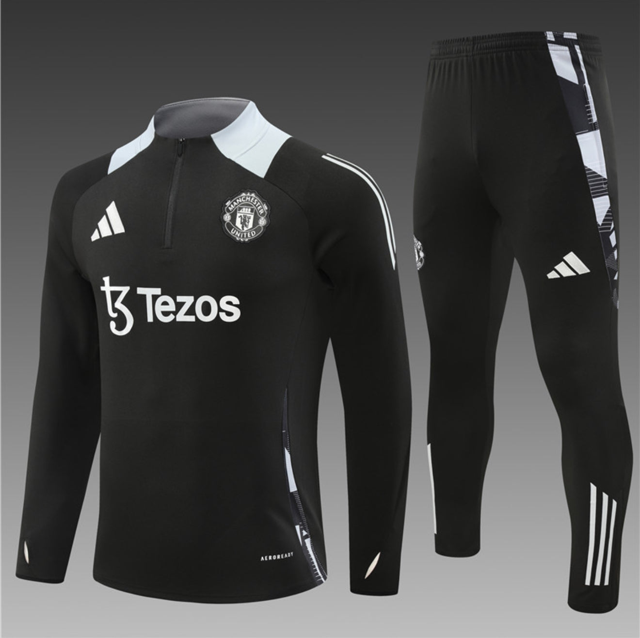 24/25 Manchester United Black 1/4 Zip Tracksuit