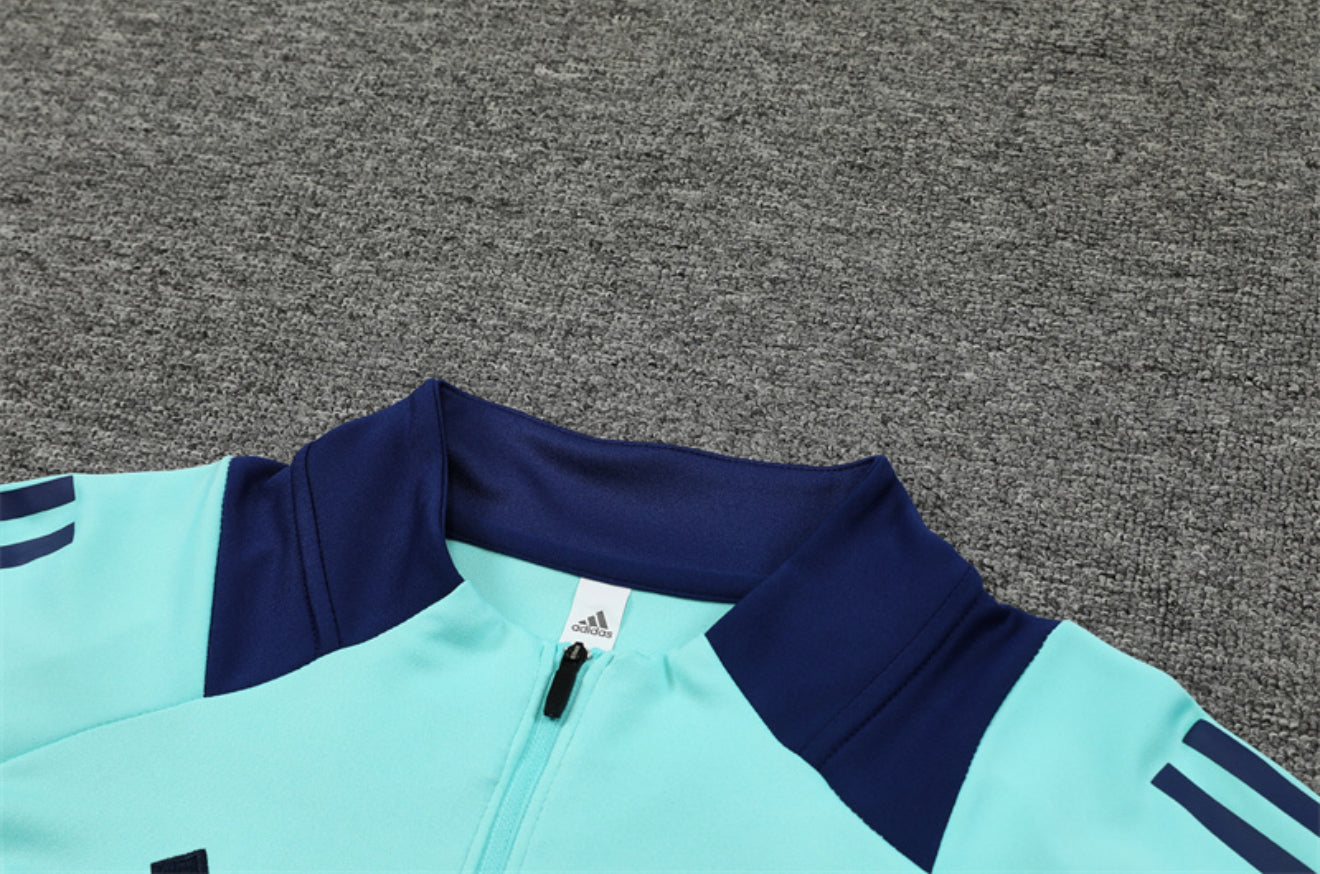 24/25 Manchester United Light Blue 1/4 Zip Tracksuit