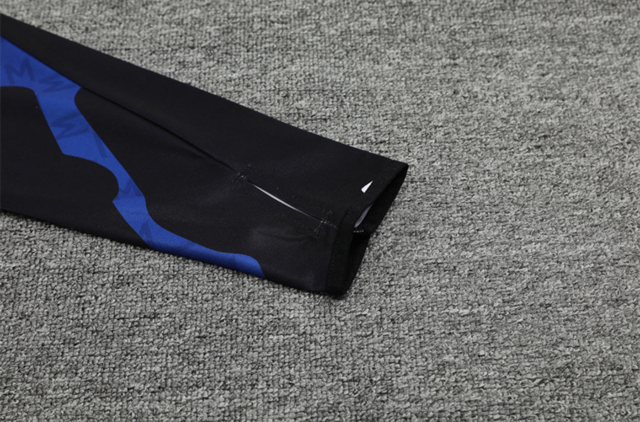 24/25 Manchester United Red, Black And Blue 1/4 Zip Tracksuit