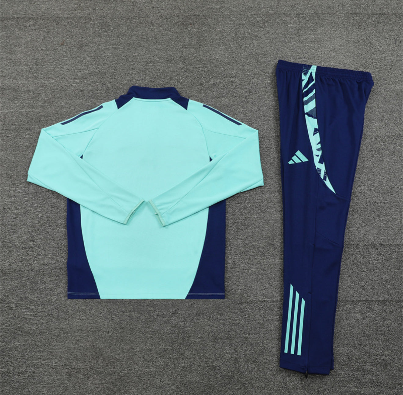 24/25 Manchester United Light Blue 1/4 Zip Tracksuit