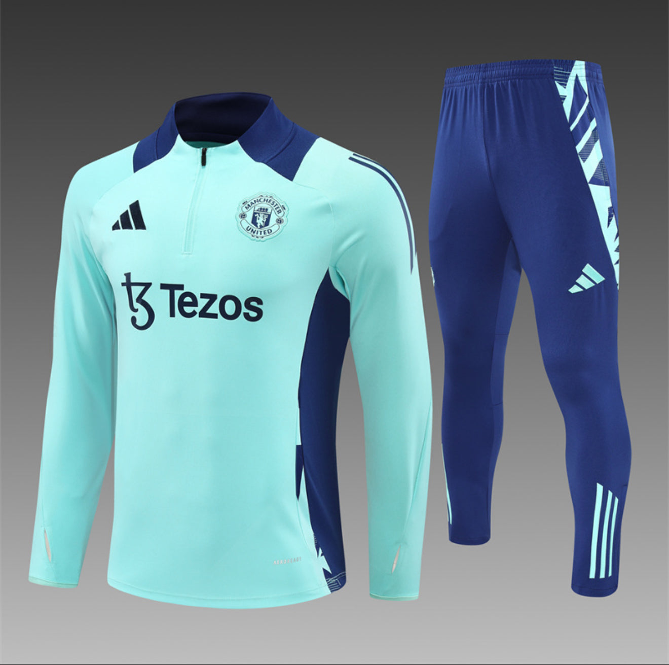 24/25 Manchester United Light Blue 1/4 Zip Tracksuit