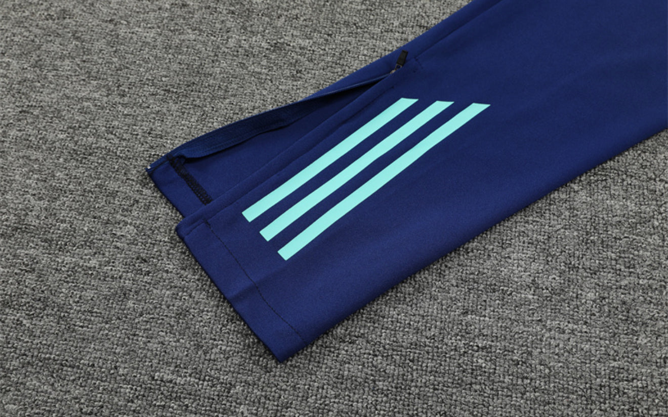24/25 Manchester United Light Blue 1/4 Zip Tracksuit